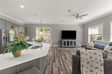 Tucked behind a canopy of mature trees, this beautifully on Oak Grove Island Golf and Country Club in Georgia - for sale on GolfHomes.com, golf home, golf lot
