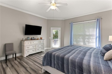 Tucked behind a canopy of mature trees, this beautifully on Oak Grove Island Golf and Country Club in Georgia - for sale on GolfHomes.com, golf home, golf lot
