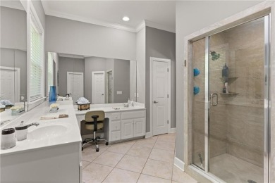 Tucked behind a canopy of mature trees, this beautifully on Oak Grove Island Golf and Country Club in Georgia - for sale on GolfHomes.com, golf home, golf lot