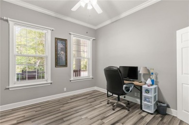 Tucked behind a canopy of mature trees, this beautifully on Oak Grove Island Golf and Country Club in Georgia - for sale on GolfHomes.com, golf home, golf lot