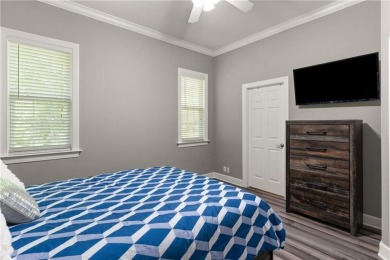 Tucked behind a canopy of mature trees, this beautifully on Oak Grove Island Golf and Country Club in Georgia - for sale on GolfHomes.com, golf home, golf lot