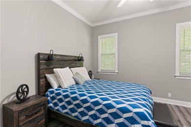 Tucked behind a canopy of mature trees, this beautifully on Oak Grove Island Golf and Country Club in Georgia - for sale on GolfHomes.com, golf home, golf lot