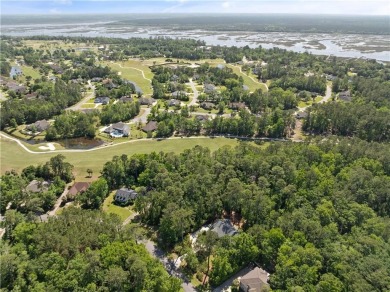 Tucked behind a canopy of mature trees, this beautifully on Oak Grove Island Golf and Country Club in Georgia - for sale on GolfHomes.com, golf home, golf lot