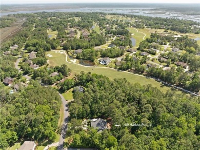 Tucked behind a canopy of mature trees, this beautifully on Oak Grove Island Golf and Country Club in Georgia - for sale on GolfHomes.com, golf home, golf lot