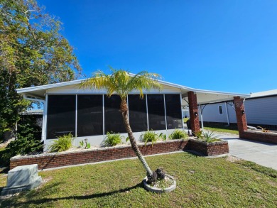 UPDATED HOME, RIGHT ACROSS FROM THE POOL! If you are looking for on Riverbend Golf and Country Club in Florida - for sale on GolfHomes.com, golf home, golf lot