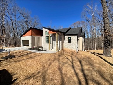 Experience modern living in this beautifully crafted new on Bella Vista - Metfield Golf Complex and Country Club in Arkansas - for sale on GolfHomes.com, golf home, golf lot