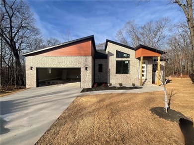Experience modern living in this beautifully crafted new on Bella Vista - Metfield Golf Complex and Country Club in Arkansas - for sale on GolfHomes.com, golf home, golf lot