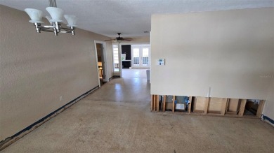 This home is located in Dana Shores - a very popular waterfront on Rocky Point Golf Course in Florida - for sale on GolfHomes.com, golf home, golf lot