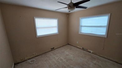 This home is located in Dana Shores - a very popular waterfront on Rocky Point Golf Course in Florida - for sale on GolfHomes.com, golf home, golf lot