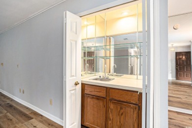 Nestled on a spacious double lot in the popular 55+ Myrtle Trace on Burning Ridge Golf Course in South Carolina - for sale on GolfHomes.com, golf home, golf lot