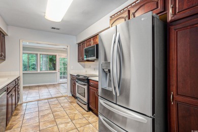 Nestled on a spacious double lot in the popular 55+ Myrtle Trace on Burning Ridge Golf Course in South Carolina - for sale on GolfHomes.com, golf home, golf lot