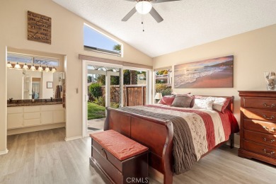 This darling home adorns a winding street in the tightly-knit on Menifee Lakes Country Club - Lakes in California - for sale on GolfHomes.com, golf home, golf lot