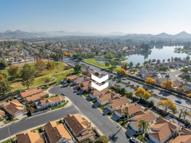 This darling home adorns a winding street in the tightly-knit on Menifee Lakes Country Club - Lakes in California - for sale on GolfHomes.com, golf home, golf lot