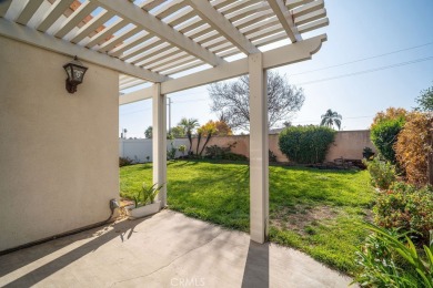 This darling home adorns a winding street in the tightly-knit on Menifee Lakes Country Club - Lakes in California - for sale on GolfHomes.com, golf home, golf lot