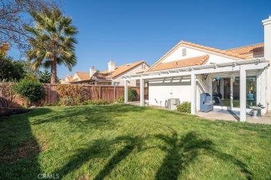 This darling home adorns a winding street in the tightly-knit on Menifee Lakes Country Club - Lakes in California - for sale on GolfHomes.com, golf home, golf lot