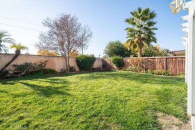 This darling home adorns a winding street in the tightly-knit on Menifee Lakes Country Club - Lakes in California - for sale on GolfHomes.com, golf home, golf lot