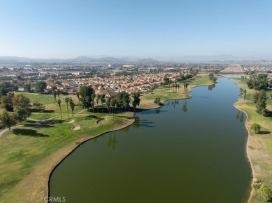 This darling home adorns a winding street in the tightly-knit on Menifee Lakes Country Club - Lakes in California - for sale on GolfHomes.com, golf home, golf lot