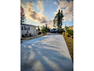 This tidy RV lot is perfect for the full time RVer or the on Deer Creek RV Golf Resort in Florida - for sale on GolfHomes.com, golf home, golf lot