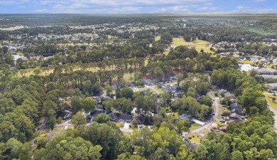 Nestled on a spacious double lot in the popular 55+ Myrtle Trace on Burning Ridge Golf Course in South Carolina - for sale on GolfHomes.com, golf home, golf lot