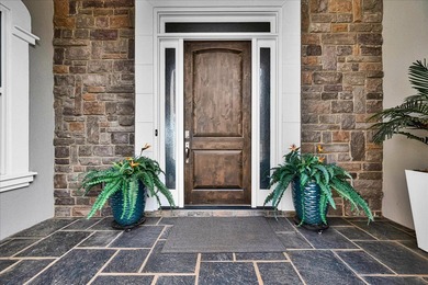 Experience elevated lake living at 244 Compass Point where on The Patriot Golf Club At Grand Harbor in South Carolina - for sale on GolfHomes.com, golf home, golf lot