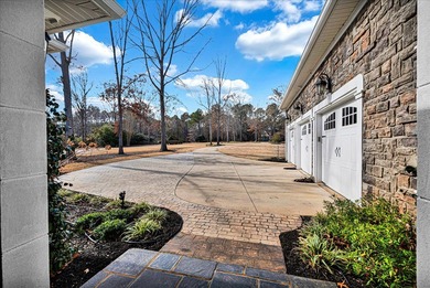 Experience elevated lake living at 244 Compass Point where on The Patriot Golf Club At Grand Harbor in South Carolina - for sale on GolfHomes.com, golf home, golf lot