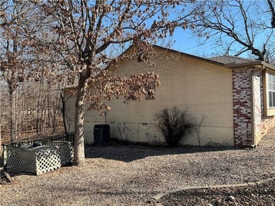 Outstanding price and location, new roof and gutters, very well on Bella Vista Country Club and Golf Course in Arkansas - for sale on GolfHomes.com, golf home, golf lot