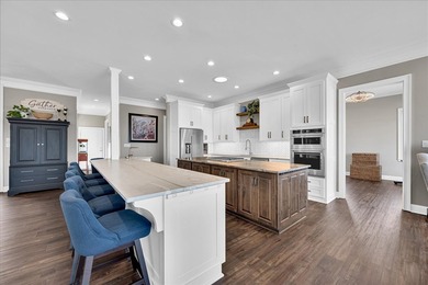 Experience elevated lake living at 244 Compass Point where on The Patriot Golf Club At Grand Harbor in South Carolina - for sale on GolfHomes.com, golf home, golf lot