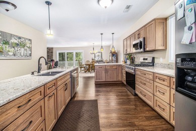 Welcome to this charming ranch-style home overlooking the 4th on Canadian Lakes Country Club-The Highlands Course in Michigan - for sale on GolfHomes.com, golf home, golf lot