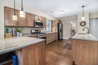Welcome to this charming ranch-style home overlooking the 4th on Canadian Lakes Country Club-The Highlands Course in Michigan - for sale on GolfHomes.com, golf home, golf lot