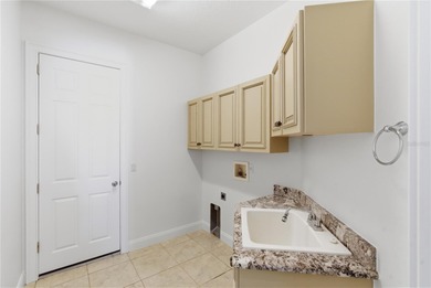 Stunning Custom Pool Home in Desirable Pine Lakes! Welcome to on The Grand Club - Pine Lakes Course in Florida - for sale on GolfHomes.com, golf home, golf lot