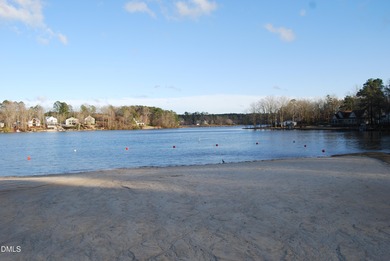 Welcome to the Lake Life! This large, beautiful, and wooded on River Golf and Country Club at Lake Royale in North Carolina - for sale on GolfHomes.com, golf home, golf lot