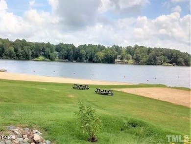 Welcome to the Lake Life! This large, beautiful, and wooded on River Golf and Country Club at Lake Royale in North Carolina - for sale on GolfHomes.com, golf home, golf lot