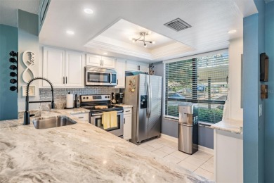 Welcome to one of Cove Cay's coveted seven condos with an on Cove Cay Country Club in Florida - for sale on GolfHomes.com, golf home, golf lot