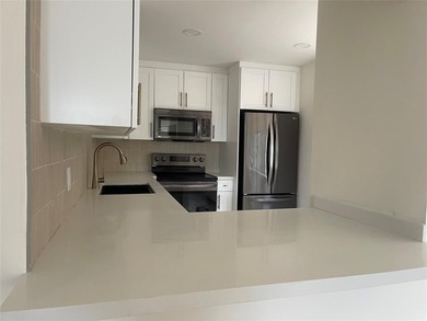 Beautifully remodeled 2 bedroom, 2 bath condo featuring a bright on Pine Island Ridge Country Club in Florida - for sale on GolfHomes.com, golf home, golf lot