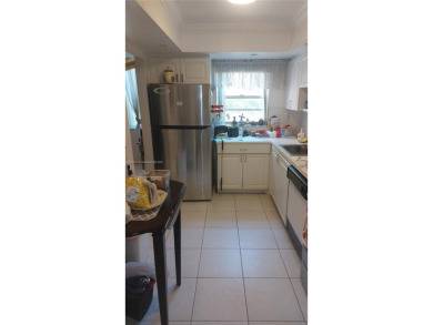 Don't miss this beautifully maintained ground floor corner unit on Pembroke Lakes Golf Club in Florida - for sale on GolfHomes.com, golf home, golf lot