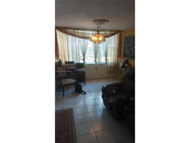 Don't miss this beautifully maintained ground floor corner unit on Pembroke Lakes Golf Club in Florida - for sale on GolfHomes.com, golf home, golf lot