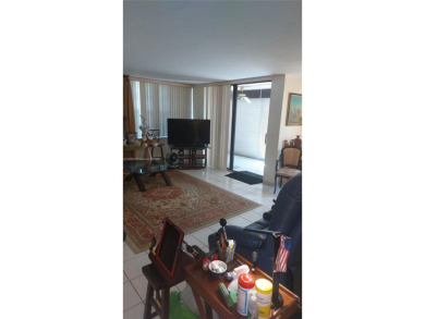 Don't miss this beautifully maintained ground floor corner unit on Pembroke Lakes Golf Club in Florida - for sale on GolfHomes.com, golf home, golf lot