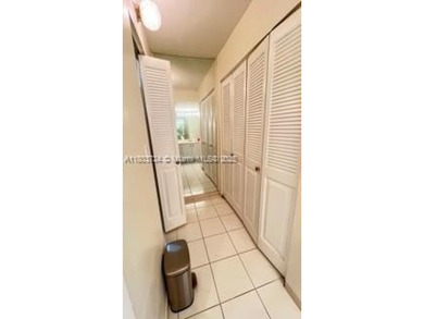 Don't miss this beautifully maintained ground floor corner unit on Pembroke Lakes Golf Club in Florida - for sale on GolfHomes.com, golf home, golf lot