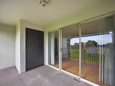 This stunning two-bedroom two-bathroom, third-floor, corner unit on Hunters Creek Golf Course in Florida - for sale on GolfHomes.com, golf home, golf lot