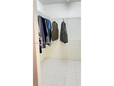 Don't miss this beautifully maintained ground floor corner unit on Pembroke Lakes Golf Club in Florida - for sale on GolfHomes.com, golf home, golf lot