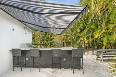 This lovely home, redesigned to be a peaceful retreat, is just a on The Wanderers Club in Florida - for sale on GolfHomes.com, golf home, golf lot