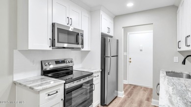 Welcome home to this fully renovated 2-bedroom, 1-bath condo on Pine Brook Golf Course in New Jersey - for sale on GolfHomes.com, golf home, golf lot