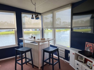 This lovely manufactured 2 bedroom, two bathroom home is on on Lake Fairways Country Club in Florida - for sale on GolfHomes.com, golf home, golf lot