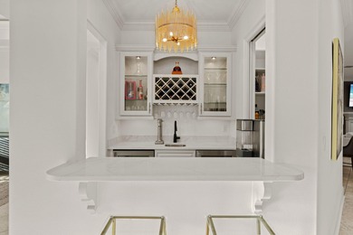 An entertainer's dream set along the 16th fairway of the Raven on Sandestin Golf and Beach Resort - Raven in Florida - for sale on GolfHomes.com, golf home, golf lot