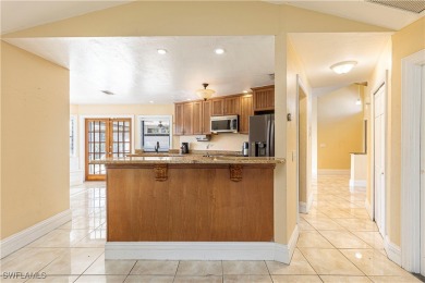 Discover your dream home in this highly sought-after on Eagle Ridge Golf and Tennis Club in Florida - for sale on GolfHomes.com, golf home, golf lot