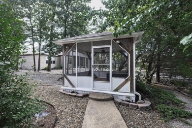 Welcome to your lakeside retreat on the desirable east side and on Granada Golf Course in Arkansas - for sale on GolfHomes.com, golf home, golf lot