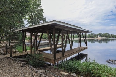 Welcome to your lakeside retreat on the desirable east side and on Granada Golf Course in Arkansas - for sale on GolfHomes.com, golf home, golf lot