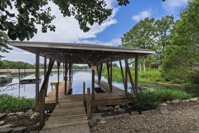 Welcome to your lakeside retreat on the desirable east side and on Granada Golf Course in Arkansas - for sale on GolfHomes.com, golf home, golf lot