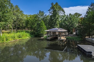 Welcome to your lakeside retreat on the desirable east side and on Granada Golf Course in Arkansas - for sale on GolfHomes.com, golf home, golf lot
