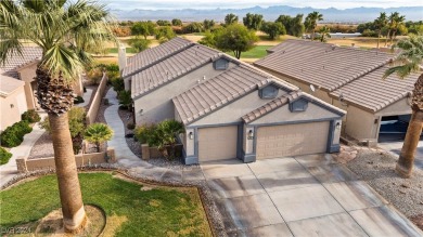 Nestled amidst the lush golf course greens and mountain vistas on Mojave Resort Golf Club in Nevada - for sale on GolfHomes.com, golf home, golf lot